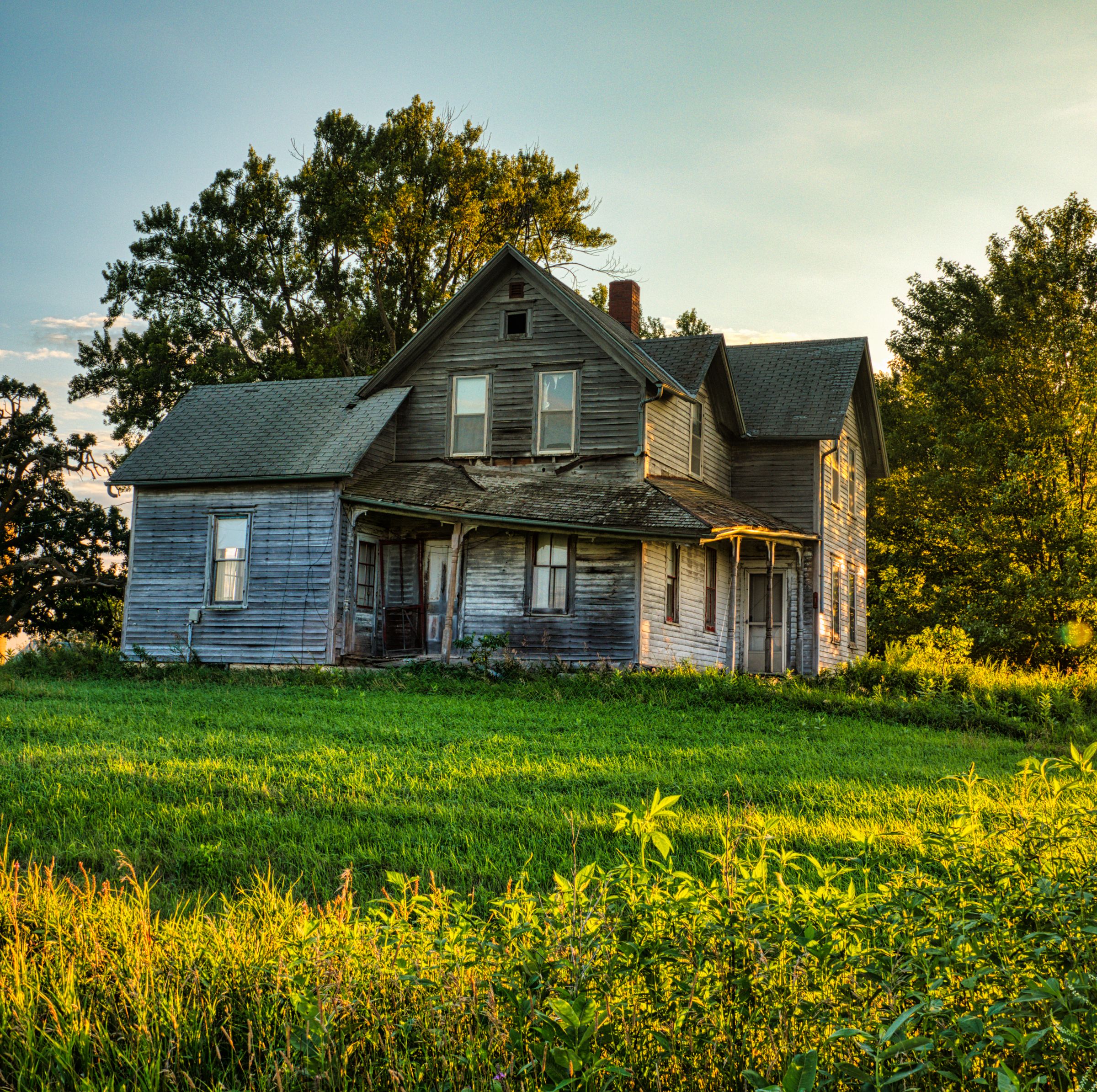 Rustic farmhouse surrounded by rural greenery